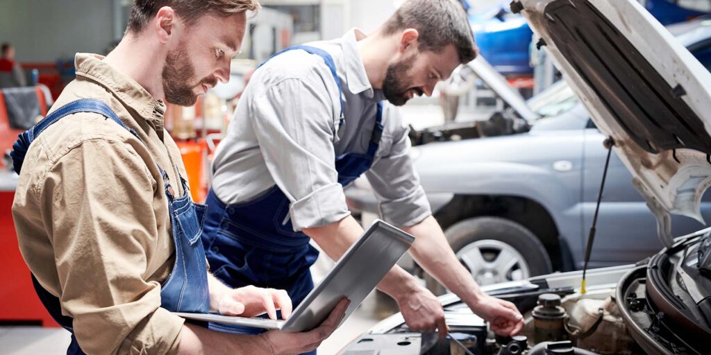 Mechanics Working in Car Service